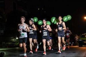 Pacers running with balloons during Bangkok night race