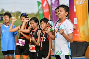 Kids showing medals Pho3nix Kids triathlon