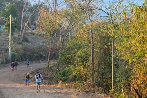 Trail runners on mountain path The North Face 100 Thailand