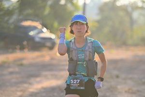 Female runner celebrating during Thailand ultra trail race
