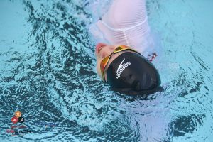Triathlete swimming during IRONMAN training session in Thailand