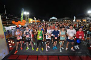 Group of runners at the start area of Laguna Phuket Marathon 2025