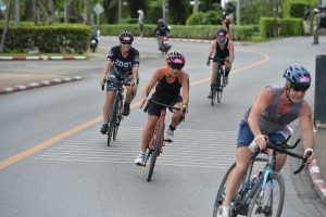 Triathletes cycling on a road during Laguna Phuket Triathlon