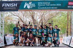 Group celebrating finish line trail event Thailand