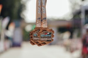Finisher medals from Laguna Phuket Marathon 2025 hanging in close-up
