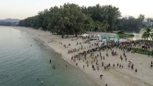 IRONMAN triathletes diving into water at race start