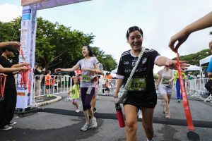 Runner receiving medal Patana Fun Run