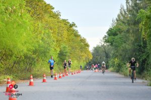 Runners and cyclists on triathlon course Thailand